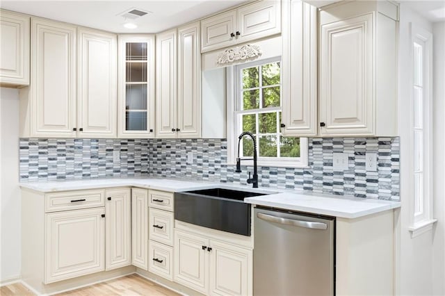 1172 Colony Dr, Marietta, GA 30068 - kitchen featuring dishwasher, decorative backsplash, and glass insert cabinets