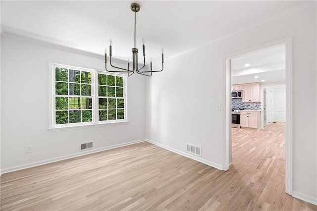 1172 Colony Dr, Marietta, GA 30068 - unfurnished dining area with a chandelier, light wood finished floors, crown molding, and recessed lighting