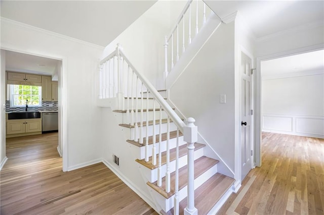 1172 Colony Dr, Marietta, GA 30068 - staircase with wood finished floors and ornamental molding