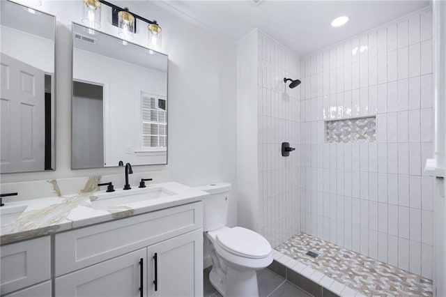 1172 Colony Dr, Marietta, GA 30068 - full bath with double vanity, a tile shower, tile patterned flooring, crown molding, and recessed lighting