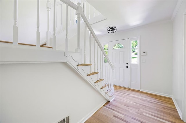 1172 Colony Dr, Marietta, GA 30068 - foyer featuring wood finished floors, stairway, and crown molding
