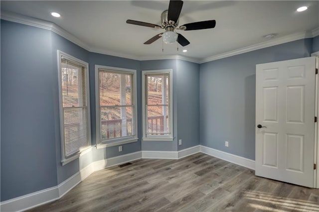 unfurnished room featuring recessed lighting, baseboards, wood finished floors, and ornamental molding