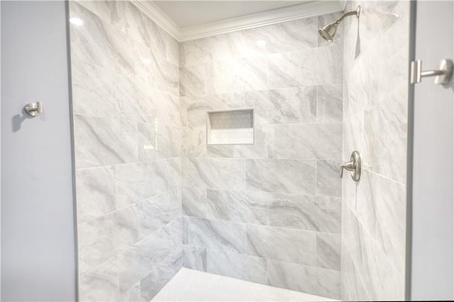 bathroom with a shower stall and ornamental molding