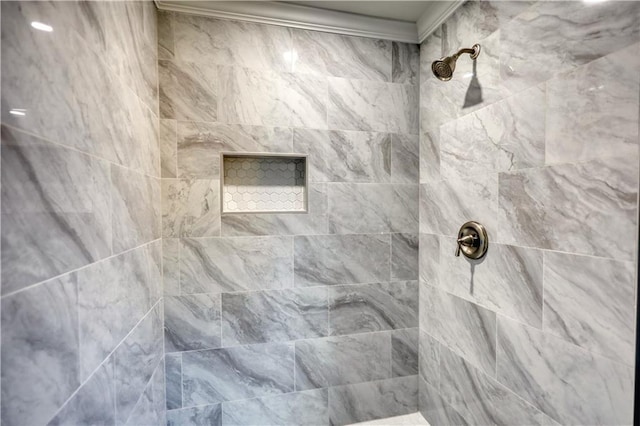 bathroom with a tile shower