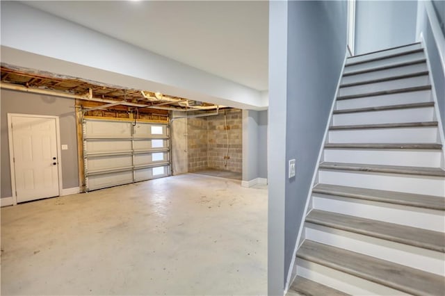 garage featuring baseboards