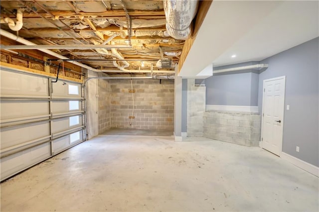 garage with concrete block wall