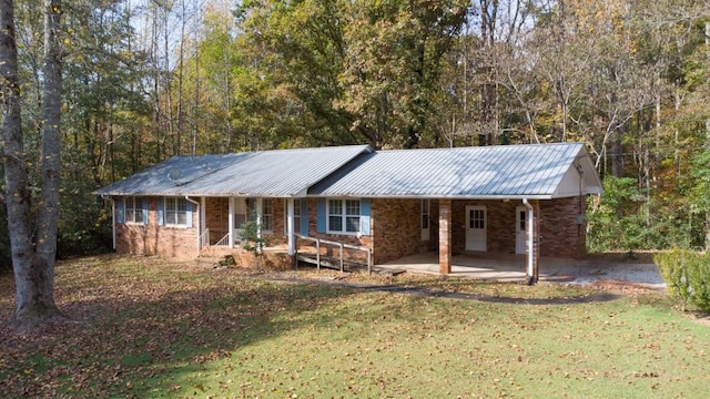 single story home with a front yard and a porch