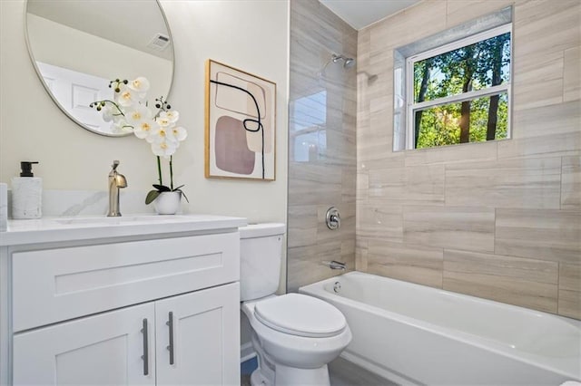 full bathroom with visible vents, shower / bathing tub combination, vanity, and toilet