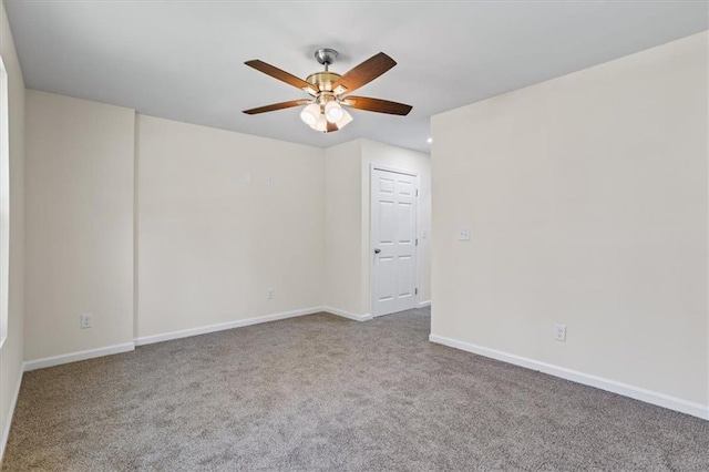 carpeted spare room featuring ceiling fan, baseboards, and recessed lighting