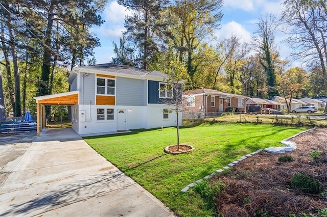 view of front facade featuring an attached carport, driveway, a front lawn, and fence