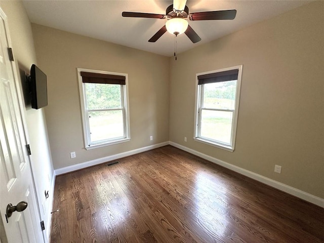 42 Powell Rd NW, Adairsville, GA 30103 - spare room with plenty of natural light, dark wood finished floors, baseboards, and a ceiling fan