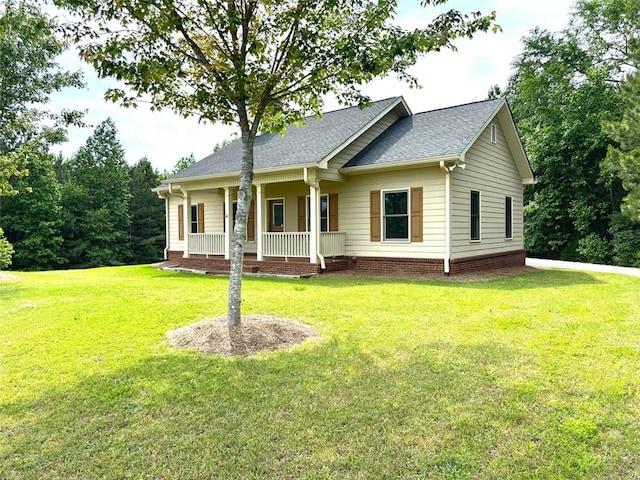 42 Powell Rd NW, Adairsville, GA 30103 - view of front of home featuring covered porch, a front yard, and roof with shingles