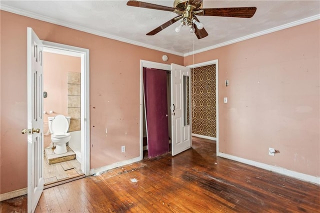 unfurnished bedroom with ceiling fan, ornamental molding, dark hardwood / wood-style flooring, and ensuite bathroom