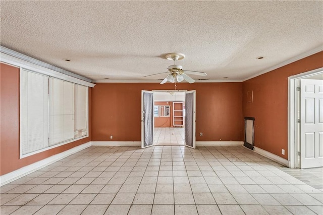 tiled empty room featuring crown molding, ceiling fan, and a textured ceiling