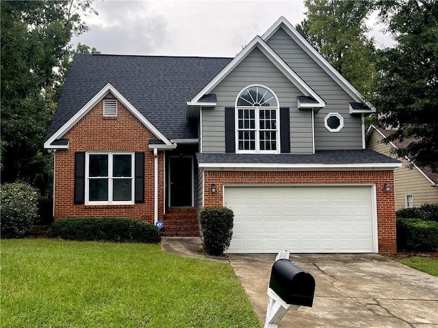 view of front of house with a front yard and a garage