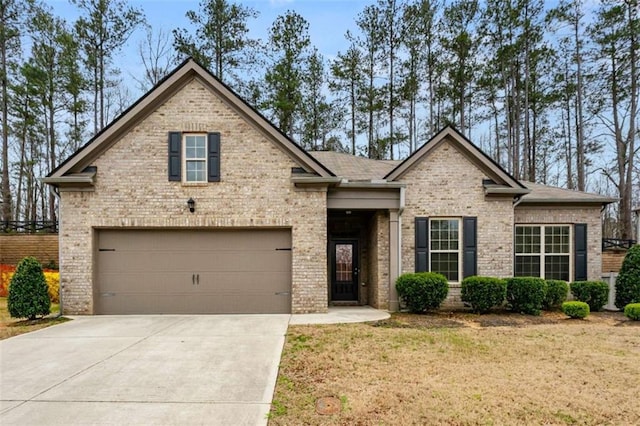 736 Red Wolf Run, Atlanta, GA 30349 - view of front of property featuring brick siding, concrete driveway, and a front lawn