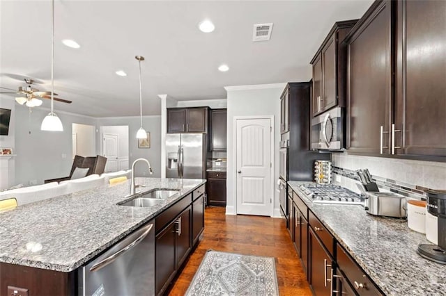 736 Red Wolf Run, Atlanta, GA 30349 - kitchen featuring visible vents, ceiling fan, light stone counters, appliances with stainless steel finishes, and a sink