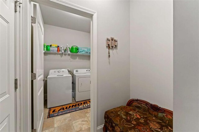 736 Red Wolf Run, Atlanta, GA 30349 - washroom featuring laundry area, stone finish floor, and independent washer and dryer