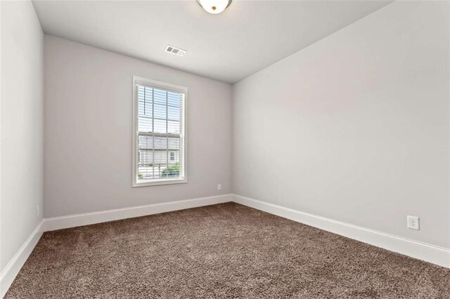 736 Red Wolf Run, Atlanta, GA 30349 - unfurnished room with visible vents, baseboards, and carpet floors