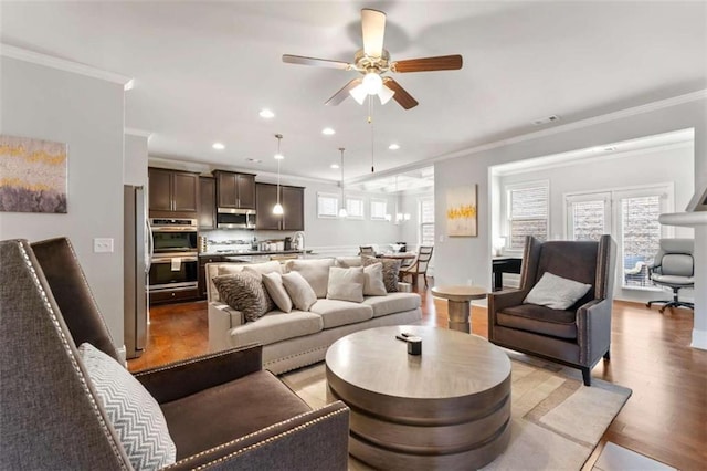 736 Red Wolf Run, Atlanta, GA 30349 - living area featuring crown molding, recessed lighting, wood finished floors, and ceiling fan