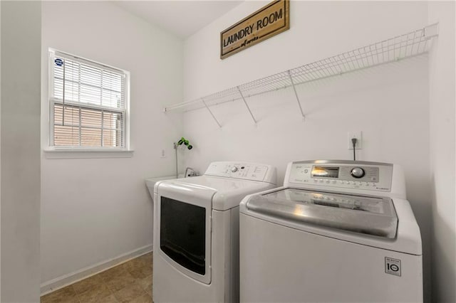 washroom with washer and clothes dryer