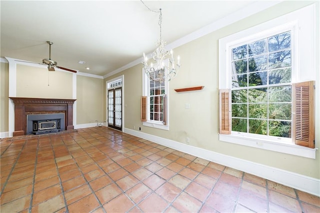 unfurnished living room with a healthy amount of sunlight, ceiling fan with notable chandelier, and ornamental molding