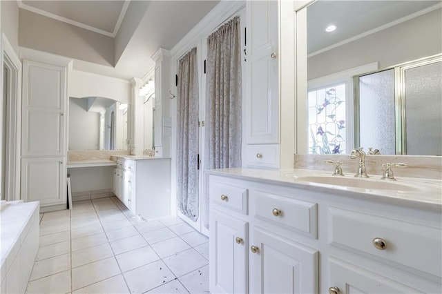 bathroom with tile patterned floors, vanity, ornamental molding, and a shower with door