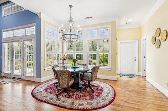 317 Red Gate Overlook, Canton, GA 30115 - dining area featuring a chandelier, crown molding, wood finished floors, and recessed lighting