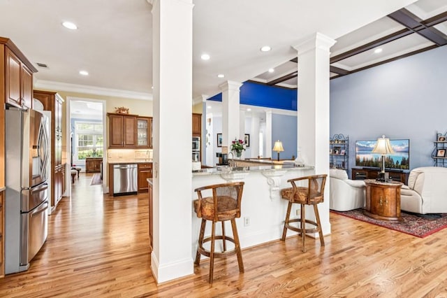 317 Red Gate Overlook, Canton, GA 30115 - kitchen featuring decorative columns, appliances with stainless steel finishes, ornamental molding, light wood-style flooring, and recessed lighting