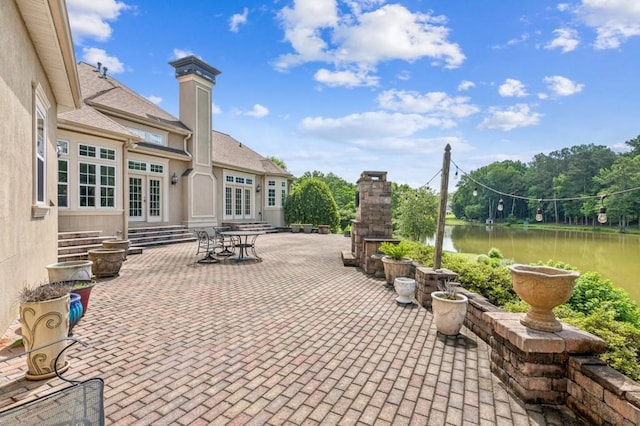 317 Red Gate Overlook, Canton, GA 30115 - view of patio featuring french doors, entry steps, and a water view