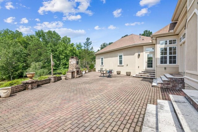 317 Red Gate Overlook, Canton, GA 30115 - view of patio featuring a fireplace with raised hearth and entry steps