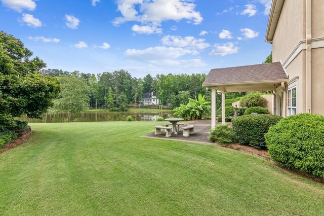 317 Red Gate Overlook, Canton, GA 30115 - view of grassy yard featuring a water view and a patio area