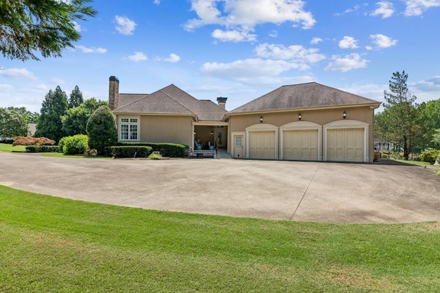 317 Red Gate Overlook, Canton, GA 30115 - traditional home with concrete driveway, a garage, a front yard, and a chimney