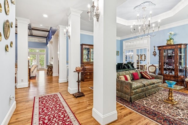 317 Red Gate Overlook, Canton, GA 30115 - entrance foyer featuring wood finished floors, crown molding, a chandelier, recessed lighting, and ornate columns