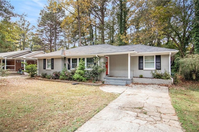 2435 Wood Valley Dr, Atlanta, GA 30344 - ranch-style house with brick siding, a front lawn, covered porch, and driveway