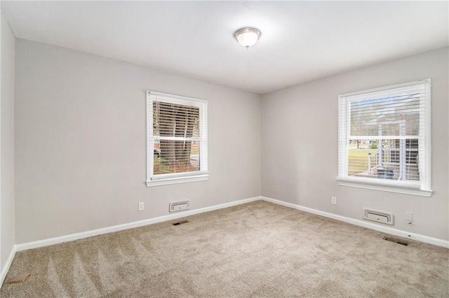 2435 Wood Valley Dr, Atlanta, GA 30344 - empty room with carpet flooring, healthy amount of natural light, and baseboards