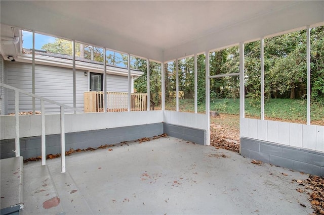 unfurnished sunroom featuring a healthy amount of sunlight