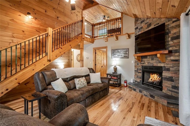 68 Whispering Hawk Ct, Morganton, GA 30560 - living room featuring a ceiling fan, stairway, wood ceiling, a stone fireplace, and hardwood / wood-style floors