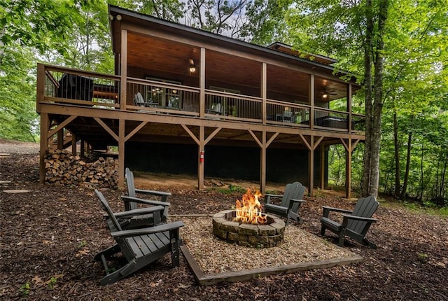 68 Whispering Hawk Ct, Morganton, GA 30560 - rear view of property with a fire pit and a wooden deck