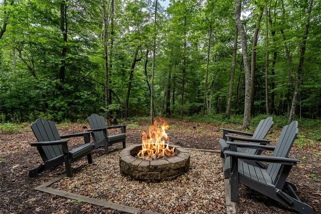 68 Whispering Hawk Ct, Morganton, GA 30560 - view of patio with a fire pit and a view of trees