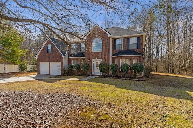 view of front facade with a garage and a front lawn