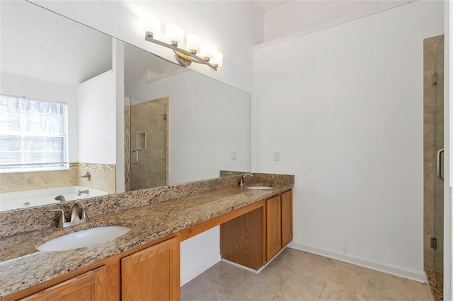 bathroom with tile patterned floors, vanity, and independent shower and bath