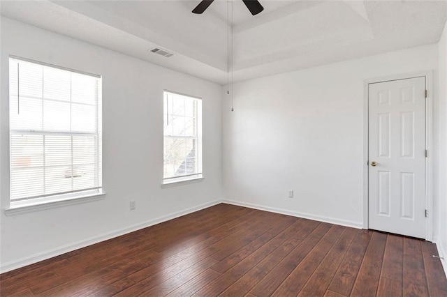 empty room featuring ceiling fan and dark hardwood / wood-style floors