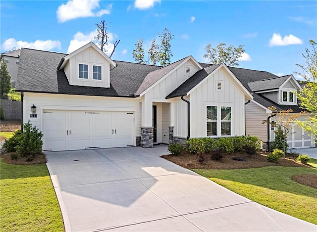modern inspired farmhouse featuring board and batten siding, concrete driveway, a front lawn, and roof with shingles