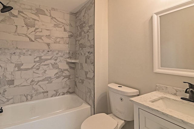 full bathroom featuring toilet, tiled shower / bath, and vanity