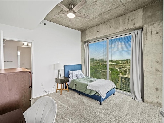 carpeted bedroom featuring a ceiling fan