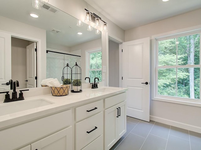 bathroom featuring vanity, tile patterned floors, and a shower with shower door