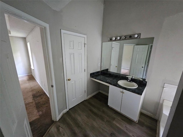 bathroom with vanity and hardwood / wood-style flooring