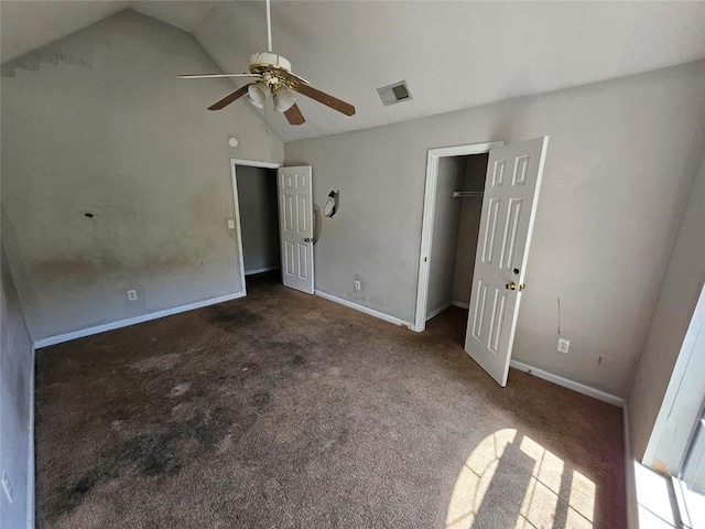 unfurnished bedroom featuring high vaulted ceiling, dark carpet, and ceiling fan