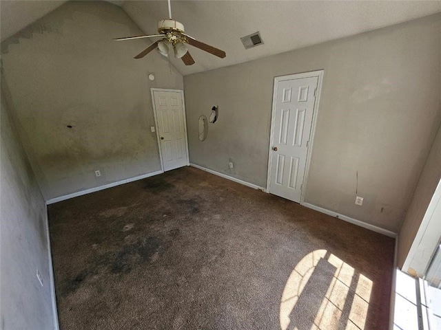 carpeted spare room featuring high vaulted ceiling and ceiling fan